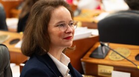 a portrait of a woman in a meeting room