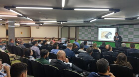 Participants sit in on a workshop in BrasÃ­lia, Brazil informing on how invest in the American real estate market. 