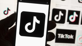 FILE - The TikTok logo is seen on a cell phone on Oct. 14, 2022, in Boston. On Dec. 12, 2022, Utah Gov. Spencer Cox issued an executive order banning TikTok on all state-owned electronic devices under the executive branch.