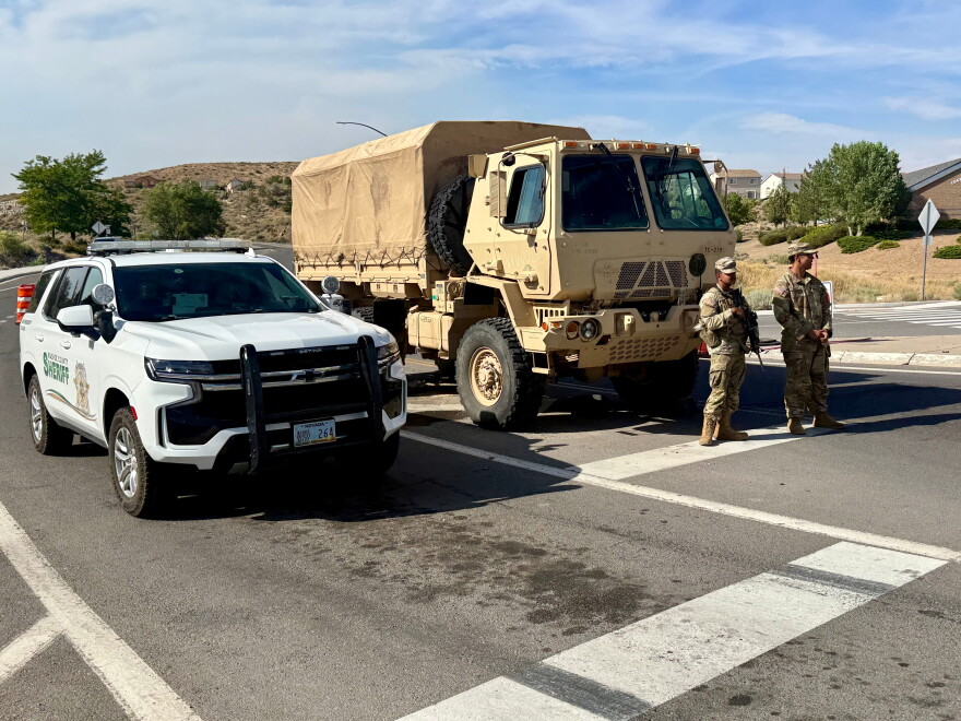 The Nevada Army National Guard blocks roads to prevent the public from re-entering evacuation zones, Sunday, Aug. 23, 2026.