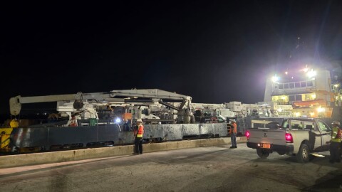 Eight utility bucket trucks belonging to the Guam Power Authority arrived at the Port of Guam on July 14, 2026, after about a 12 hour trip by barge from Saipan.