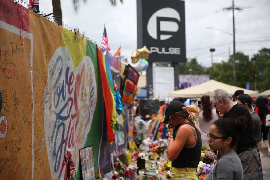 One year after the Pulse shooting, the community gathers at the club for vigils and remembrance. Photo: Joey Roulette