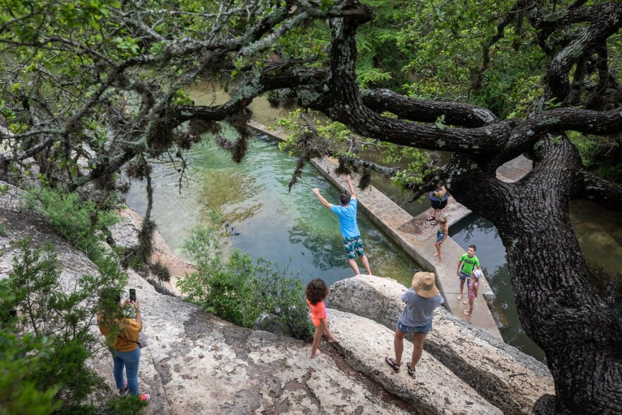  Two years ago, the water was deep enough for visitors to jump into Jacob's Well. The area got only about half the rain it should’ve gotten last summer.