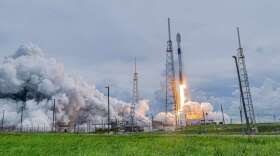 A SpaceX Falcon 9 rocket takes off, leaving behind a cloud of smoke. Photo: Matt Cutshall