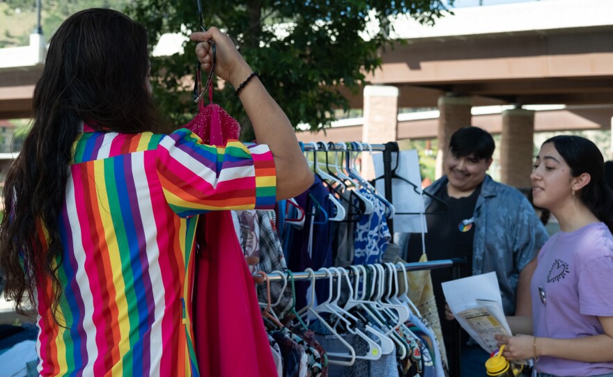 The Rainbow Closet, a group that provides free gender-affirming clothing and trans accessories, came up from Grand Junction for the event with racks of free clothes and the expertise of volunteers encouraging people to try items that affirm their gender identity.