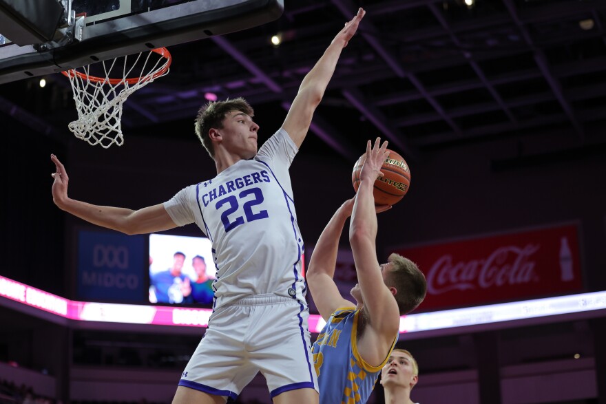 Sioux Falls Christian's Griffen Goodbary blocks a Hamlin player's shot.