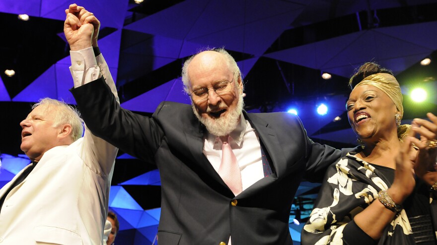 Flanked by composer Leonard Slatkin and soprano Jessye Norman, John Williams takes a bow during his 80th-birthday celebration at Tanglewood in August.