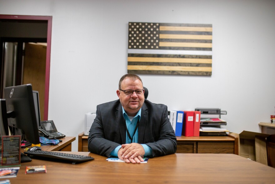 Warden Shawn Brewer at his desk