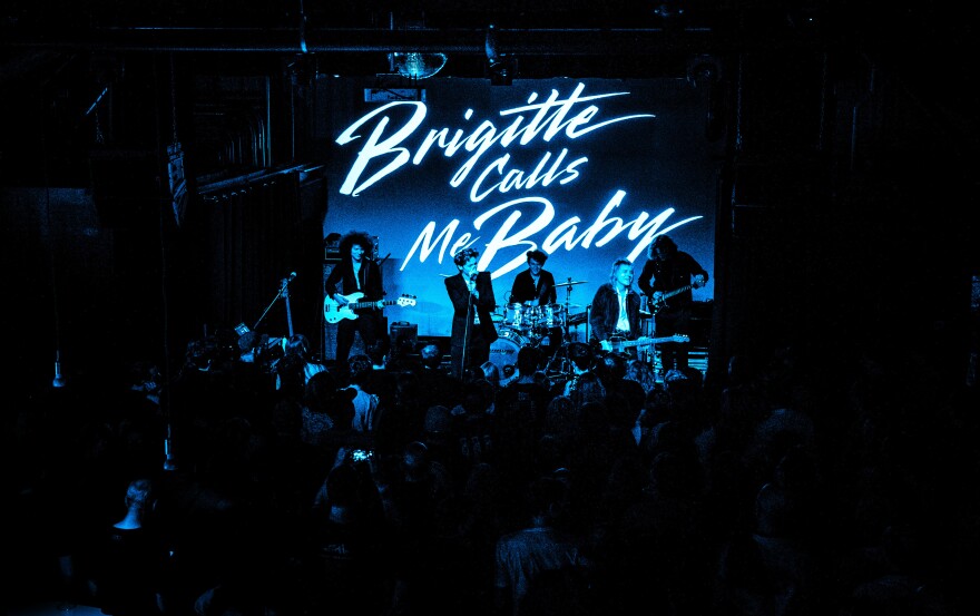 a band performing to a crowd 