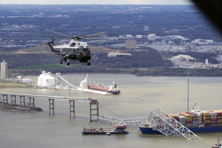 President Joe Biden, aboard Marine One, takes an aerial tour of the collapsed Francis Scott Key Bridge in Baltimore, Friday, April 5, 2024, as seen from an accompanying aircraft. (AP Photo/Manuel Balce Ceneta)