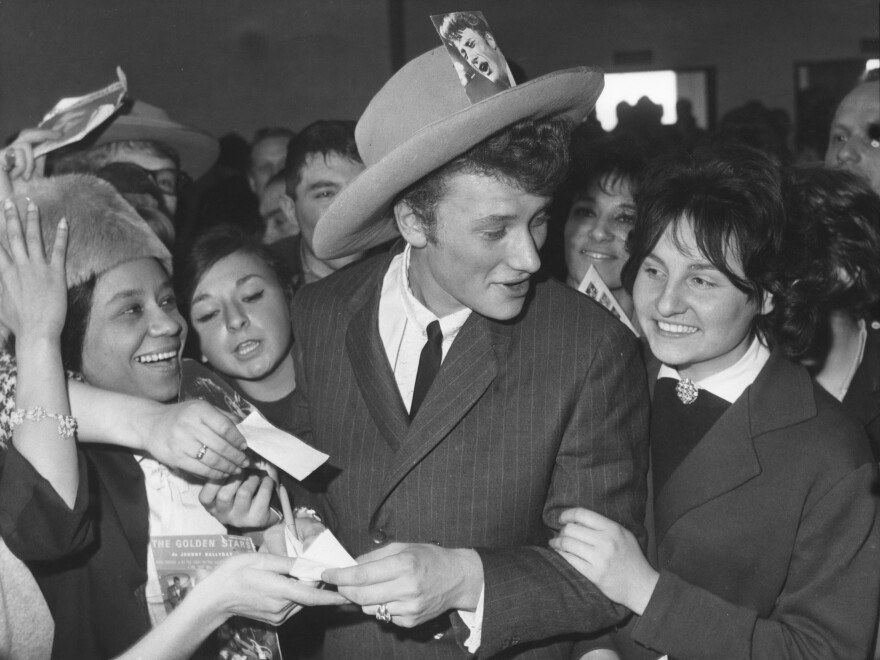 Johnny Hallyday was surrounded by fans at Orly Airport in Paris, on his return from a tour of the United States in 1962.