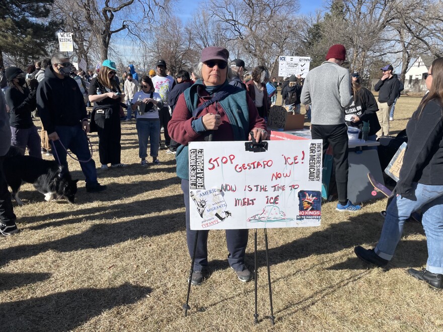 A local woman holds up a sign protesting ICE at La Alma–Lincoln Park in Denver on Friday, Jan. 30, 2026.