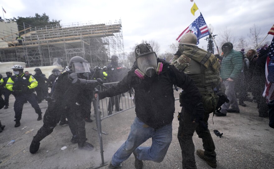 Trump supporters try to break through a police barrier during protests Wednesday at the Capitol.
