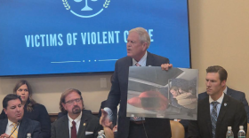 South Carolina Republican Congressman Ralph Norman holds a photo of 23-year-old Iryna Zarutska taken from security footage moments after she was stabbed.