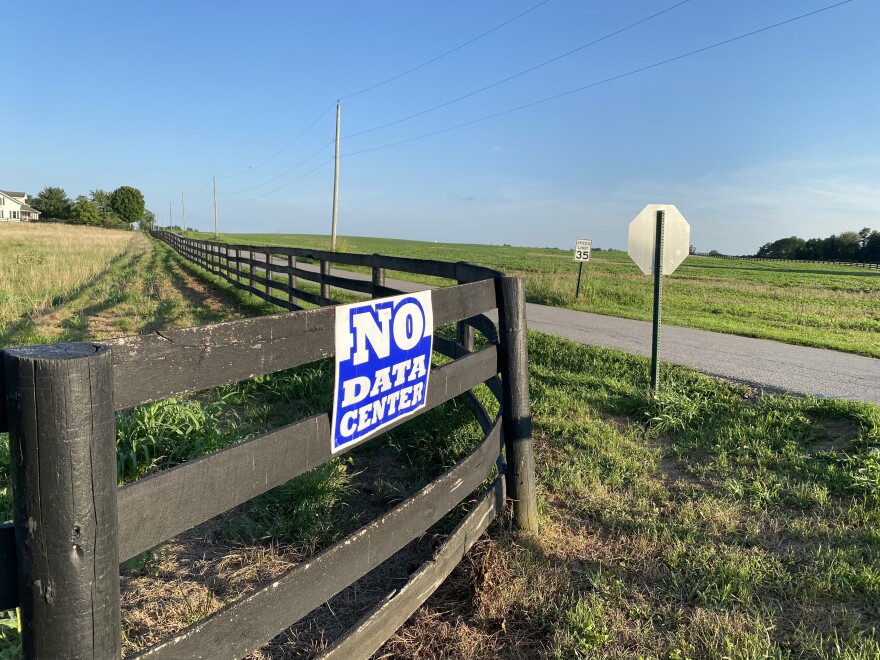 An anti-data center sign is across the street from farmland where a massive hyperscale data center has been proposed in rural Mercer County.