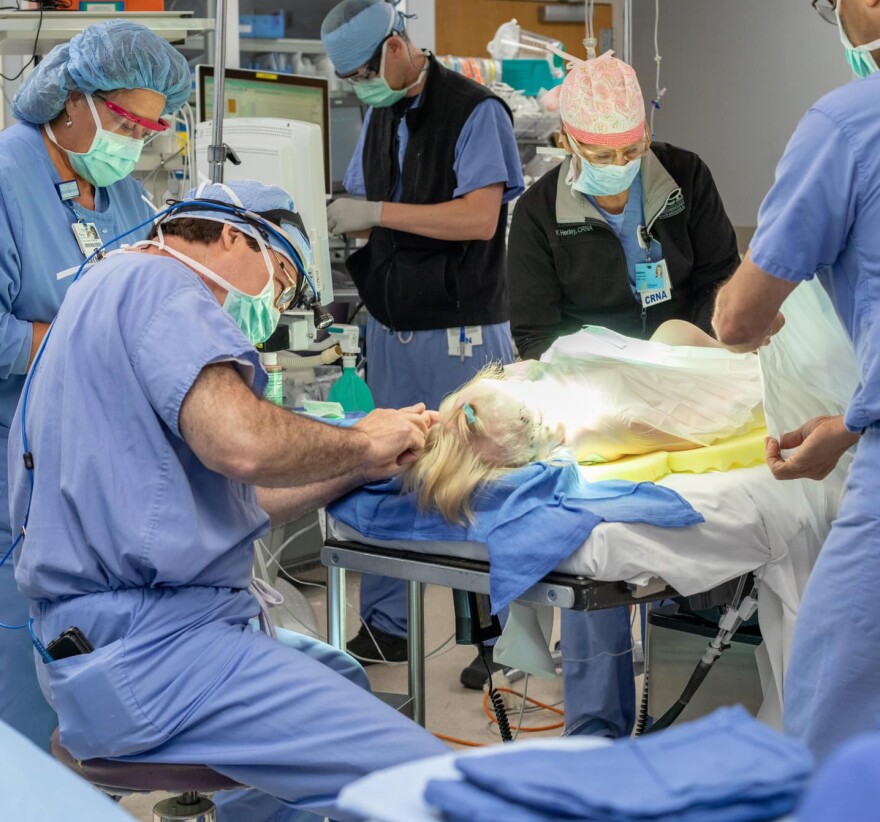 Dr. Larry Sargent, preparing Beth Wilson for her mid-face surgical procedure during the film of “Beautiful Faces.”