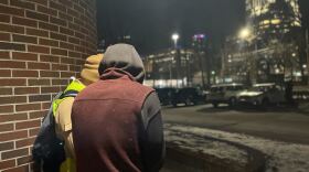 Two surveyors in uptown on Jan. 23.