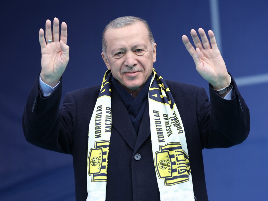 Turkish President Recep Tayyip Erdogan waves to supporters during an election campaign rally in Ankara, on April 30.