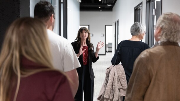 Lauren Jones leads a tour during the Collaborative Care Clinic open house on Feb. 20.