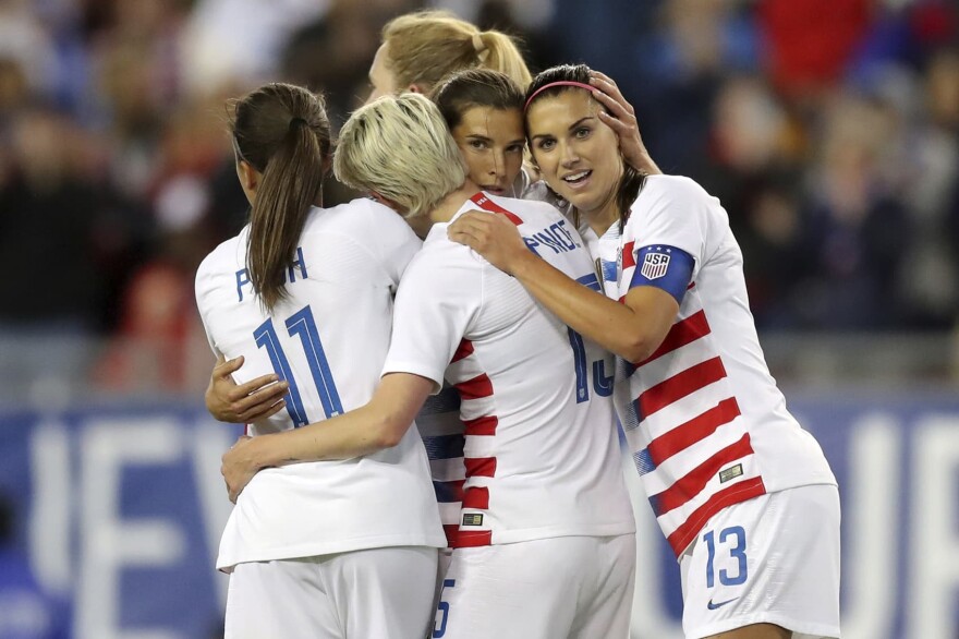 United States' Tobin Heath, second from right, is congratulated on her goal by Mallory Pugh (11), Megan Rapinoe and Alex Morgan (13) during the first half of a SheBelieves Cup soccer match against Brazil in Tampa, Fla., March 5, 2019. (Mike Carlson, File/AP)