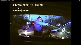 This Jan. 15, 2020, still image from dashboard camera video released by the Connecticut State Police shows Trooper Brian North after discharging his weapon and fatally shooting Mubarak Soulemane following a high-speed chase. North was arrested Tuesday night, April 19, 2022, in connection with the shooting, state police said.