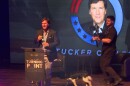 Tucker Carlson appeared onstage at the IU Auditorium with his two Springer Spaniels.