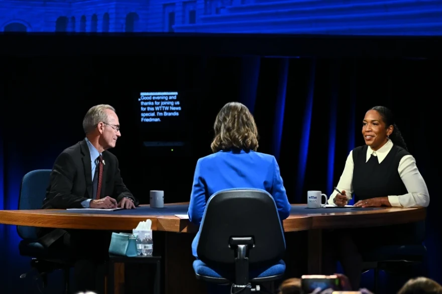 Republican nominee Don Tracy, left, moderator and “Chicago Tonight” anchor Brandis Friedman, center, and Democratic U.S. Senate nominee Juliana Stratton converse on set during the WTTW News U.S. Senate Candidate Forum on Tuesday at the Renée Crown Public Media Center in Chicago