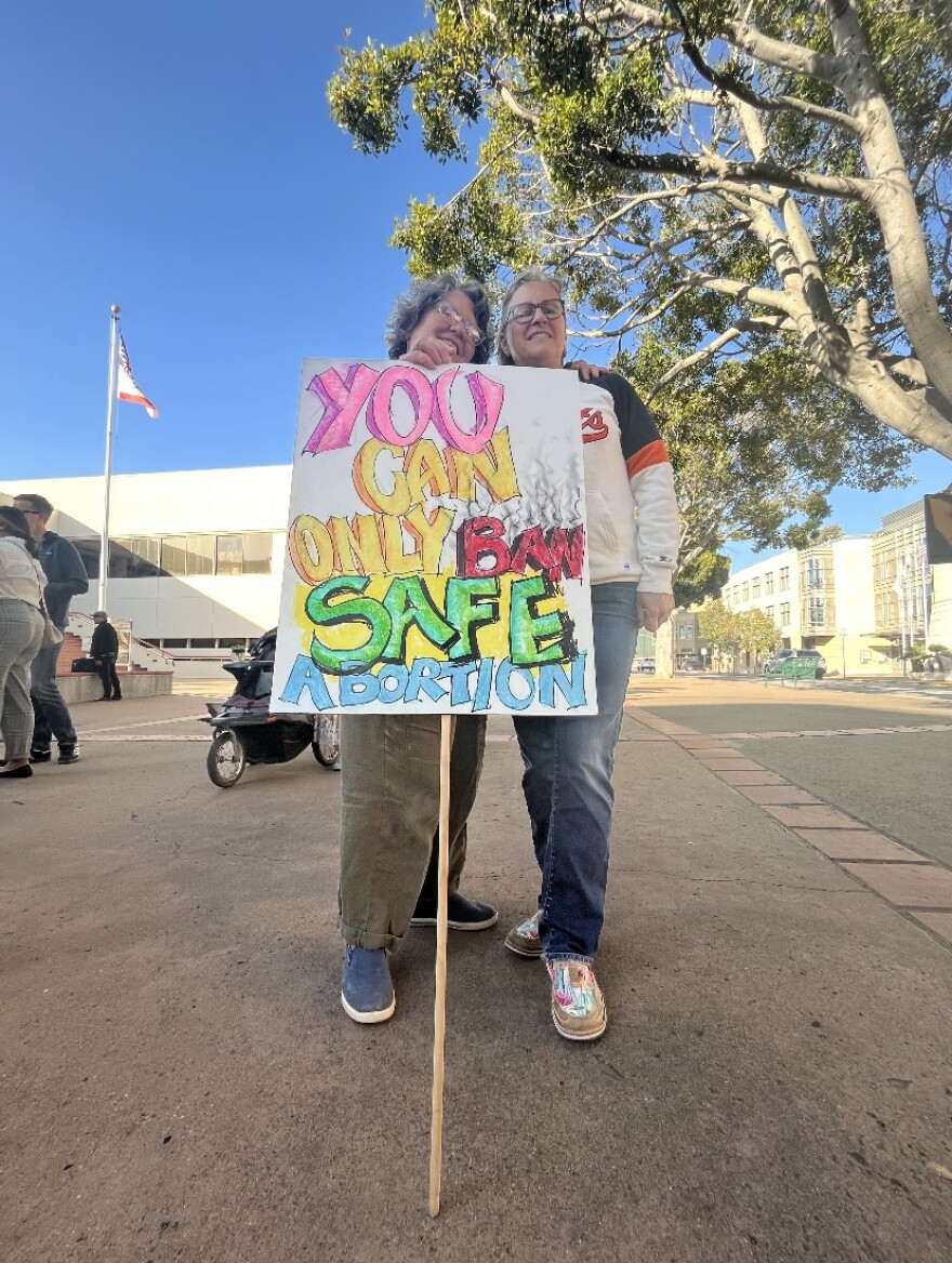 Erma Stauffer and Nina Truch participated in a demonstration in Downtown SLO Tuesday evening.