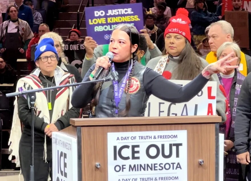 Rachel Dionne-Thunder, a Bigstone Cree Nation descendant and vice president of the Indigenous Protector Movement, addresses a crowd at Minneapolis’ Target Center arena on Friday, January 23, 2026 during a large-scale rally and march protesting a surge in federal immigration officers in the state. “What we're really seeing is a continuation of tactics that us as Native people are very accustomed to,” she says. “But what is happening now that is different is out there now is that more American citizens are waking up to the reality of what it means to be existing under an authoritarian regime. We, as Native people, already know and understand that and have been fighting against it for generations.”