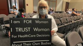 Patricia Ledbetter of DeSoto holds a sign supporting women's rights at the Texas Democratic Party's biennial convention in Dallas.