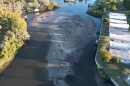 A blob of sand protrudes from the center of Phillippi Creek, as shown in an aerial image