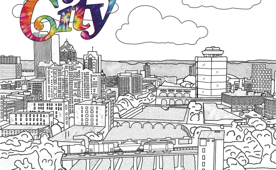 The front cover of CITY Magazine features a drawing of many buildings. The cover is white with the name of the magazine displayed in many colors.