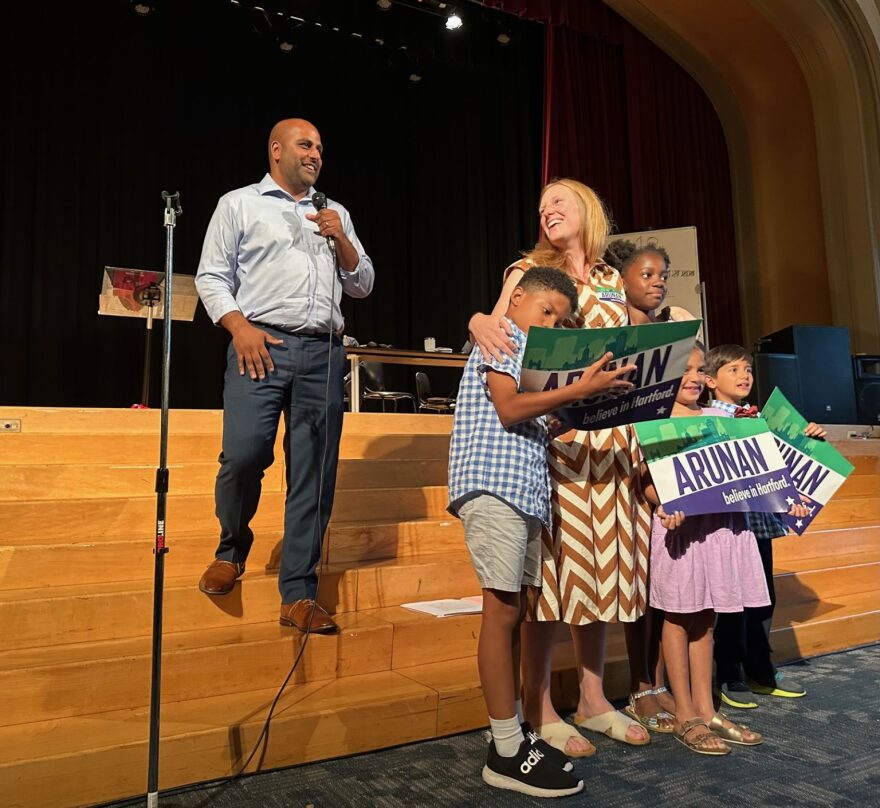 Arunan Arulampalam accepts Hartford's Democratic mayoral endorsement, accompanied by his wife, the Rev. Liza Arulampalam, and four of their five children.