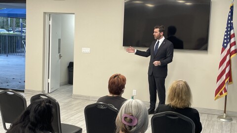 Oliver Larkin at a town hall event in Deerfield Beach
