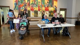 Carlos Menjivar's wife, Johanna (behind stroller) and their three young children seek refuge at Fountain Street Church on June 11th.