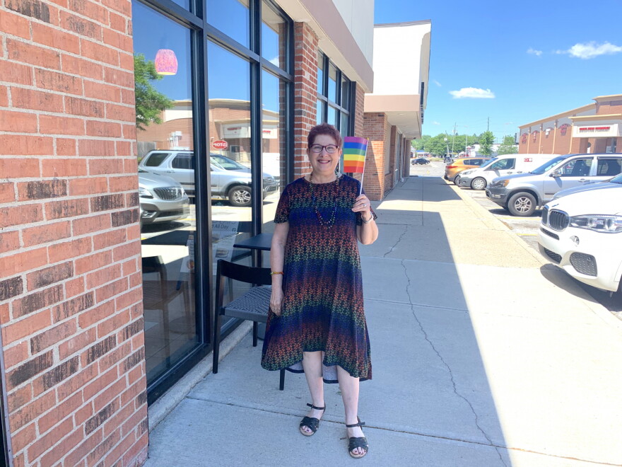 Annette Siegel Gross waves her flag with pride on the Northside of Indianapolis