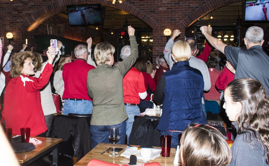 Redbird fans sing the fight song together to prepare for the game.