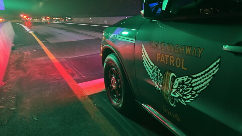Am Ohio State Highway Patrol cruiser protects a crime scene in Cincinnati.