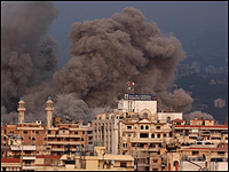 Smoke rises after an Israeli raid near Bahman hospital in Haret Hreik in the southern suburbs of Beirut, Hezbollah's stronghold.