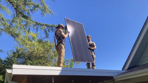 Contractors install solar panels on the roof of a house in Oregon. The mix of state, federal and private and nonprofit subsidies for solar panels have led to major growth in residential solar in the last decade, and today about 25,000 homeowners in Oregon are generating solar energy, according to the Oregon Energy Trust.