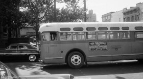 FILE - In this April 26, 1956, file photo, a bus driver is all alone as his empty bus moves through downtown Montgomery, Ala, as a boycott continues even though the bus company has ordered an end to segregation. The 60th anniversary of the Montgomery bus boycott is widely credited with helping spark the modern civil rights movement. (AP Photo/Horace Cort, file)