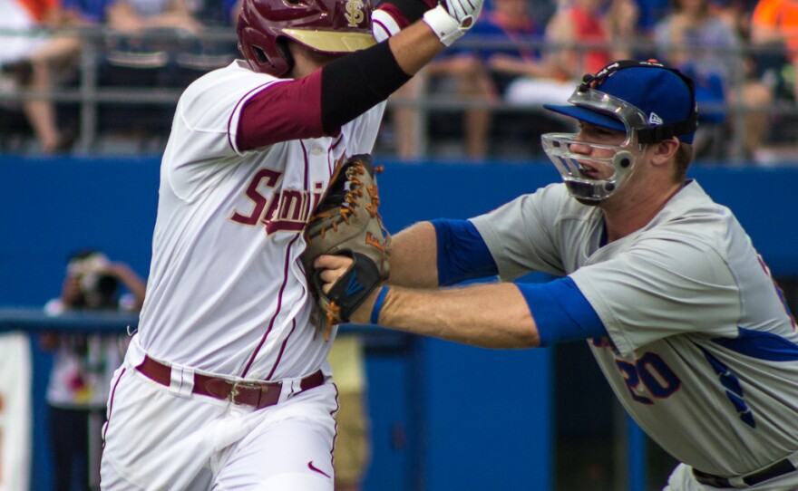 Florida first baseman Peter Alonso gets FSU runner John Sansone out in the first inning of the Gainesville Super Regional on June 6.