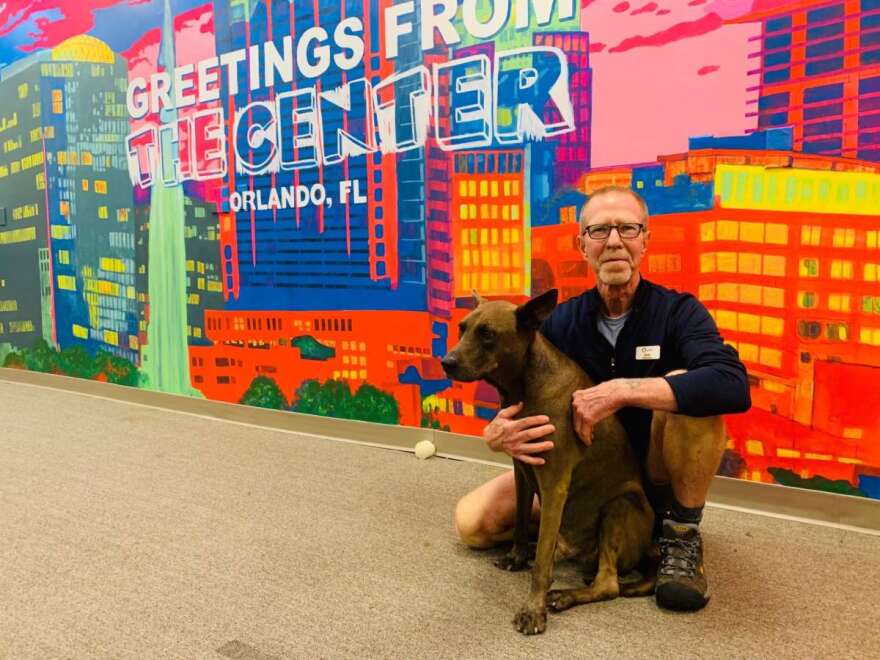 Rick Kann and his dog Otis at the LGBT Center in Orlando. (via Talia Blake/WMFE)