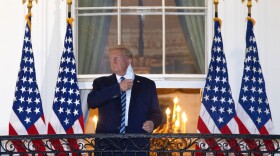 President Trump removes his mask upon return to the White House from Walter Reed National Military Medical Center on Oct. 05, 2020 in Washington, DC. Trump spent three days hospitalized for coronavirus. (Win McNamee/Getty Images)