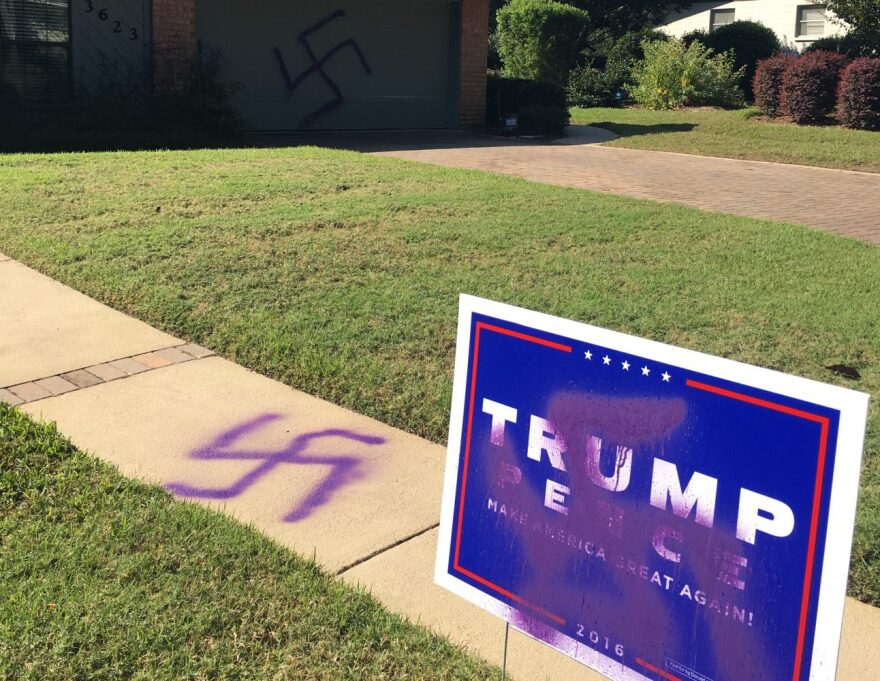 Gainesville resident Ronnie Sartain woke up to swastika symbols spray painted on his garage door, sidewalk and Trump campaign sign Wednesday, October 26, 2016. (Marcy Grace Scully/WUFT News)