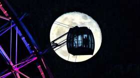 This photo of the Orlando Eye and a full moon is one of many taken by Red Huber over the last 45 years./Photo: Red Huber