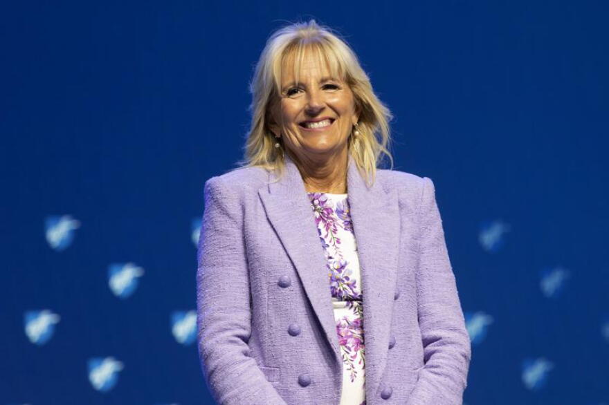 FILE - First lady Jill Biden smiles as she is introduced before speaking during the American Federation of Teachers convention, July 15, 2022, in Boston. Jill Biden and Education Secretary Miguel Cardona are kicking off a summer learning tour this week with stops in Connecticut, Georgia and Michigan over two days.