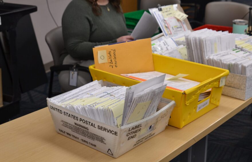 Ballots that had arrived by mail or were set aside on Election Day sit on a table at the Cass County Courthouse on Nov. 18, 2024, waiting to be reviewed