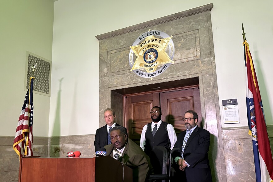 From left: Attorney Justin Gelfand, Sheriff Alfred Montgomery and attorney Matt Ghio watch as Sheriff’s Department staff attorney David C. Mason addresses the press following the first hearing in the Missouri Attorney General’s quest to remove Montgomery from office on Wednesday, July 9, 2025, at the Hon. Clyde S. Cahill Courthouse in downtown St. Louis.