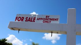 A For Sale sign displayed in front of a home in Miami, Florida.